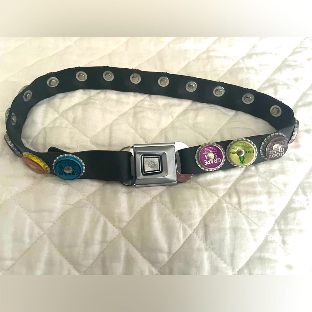 Fun belt!  Bottle caps on leather with seat belt buckle
